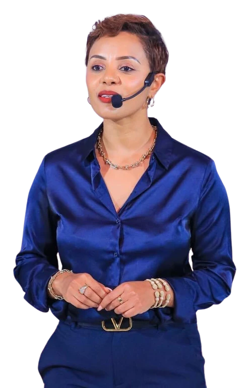 Daggy speaking in a navy outfit with a headset microphone
