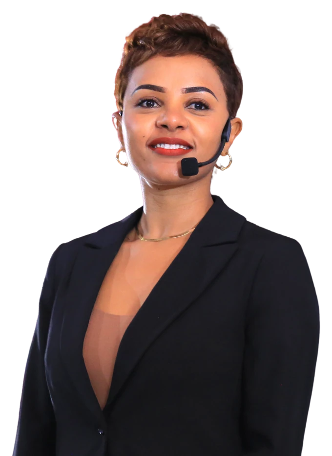 Daggy presenting in a black blazer with a headset microphone